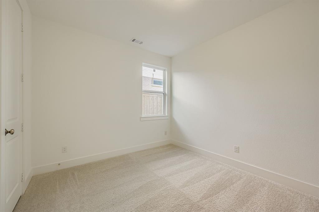 6036 Davis Knoll Road Fort Worth, TX 76126 - Photo 20 of 29 an empty room with a window