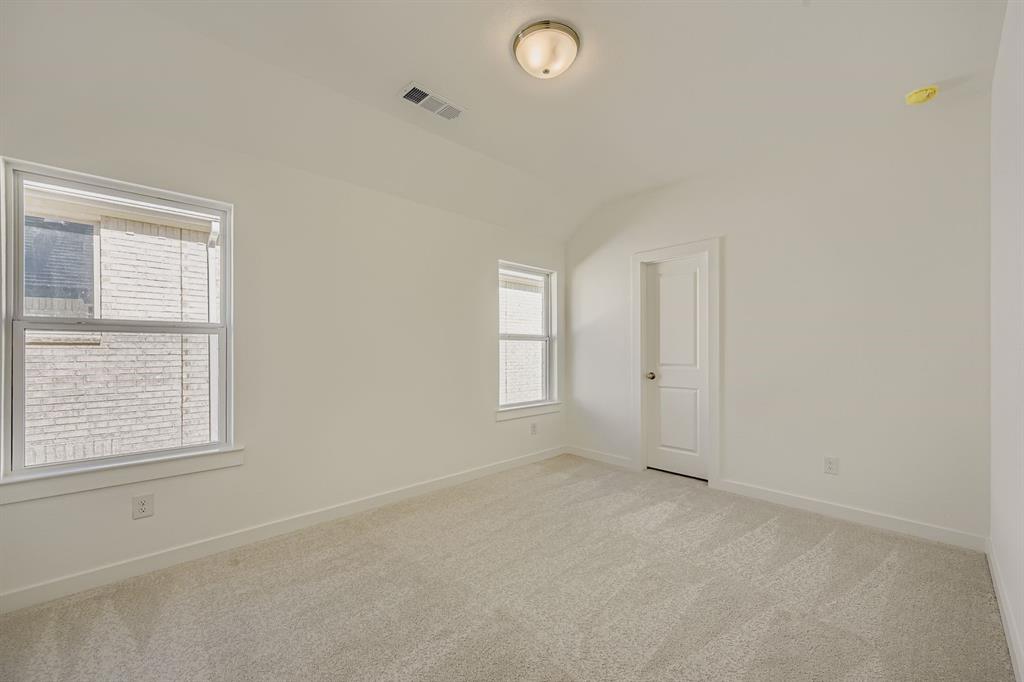 6036 Davis Knoll Road Fort Worth, TX 76126 - Photo 22 of 29 an empty room with windows