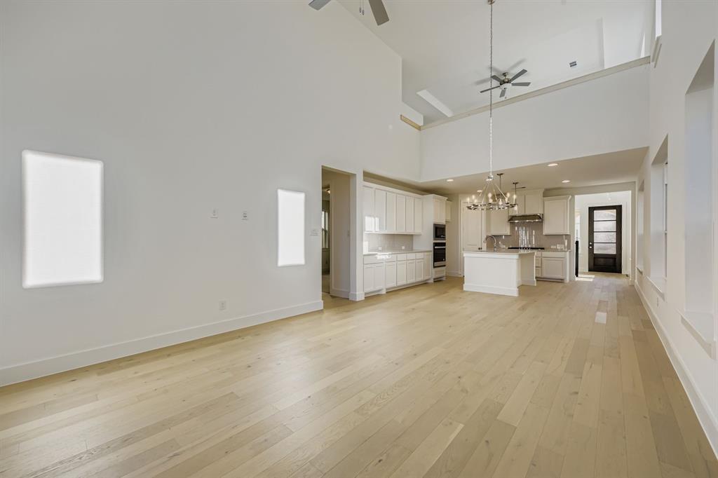 6036 Davis Knoll Road Fort Worth, TX 76126 - Photo 7 of 29 a view of a kitchen with a sink and a refrigerator