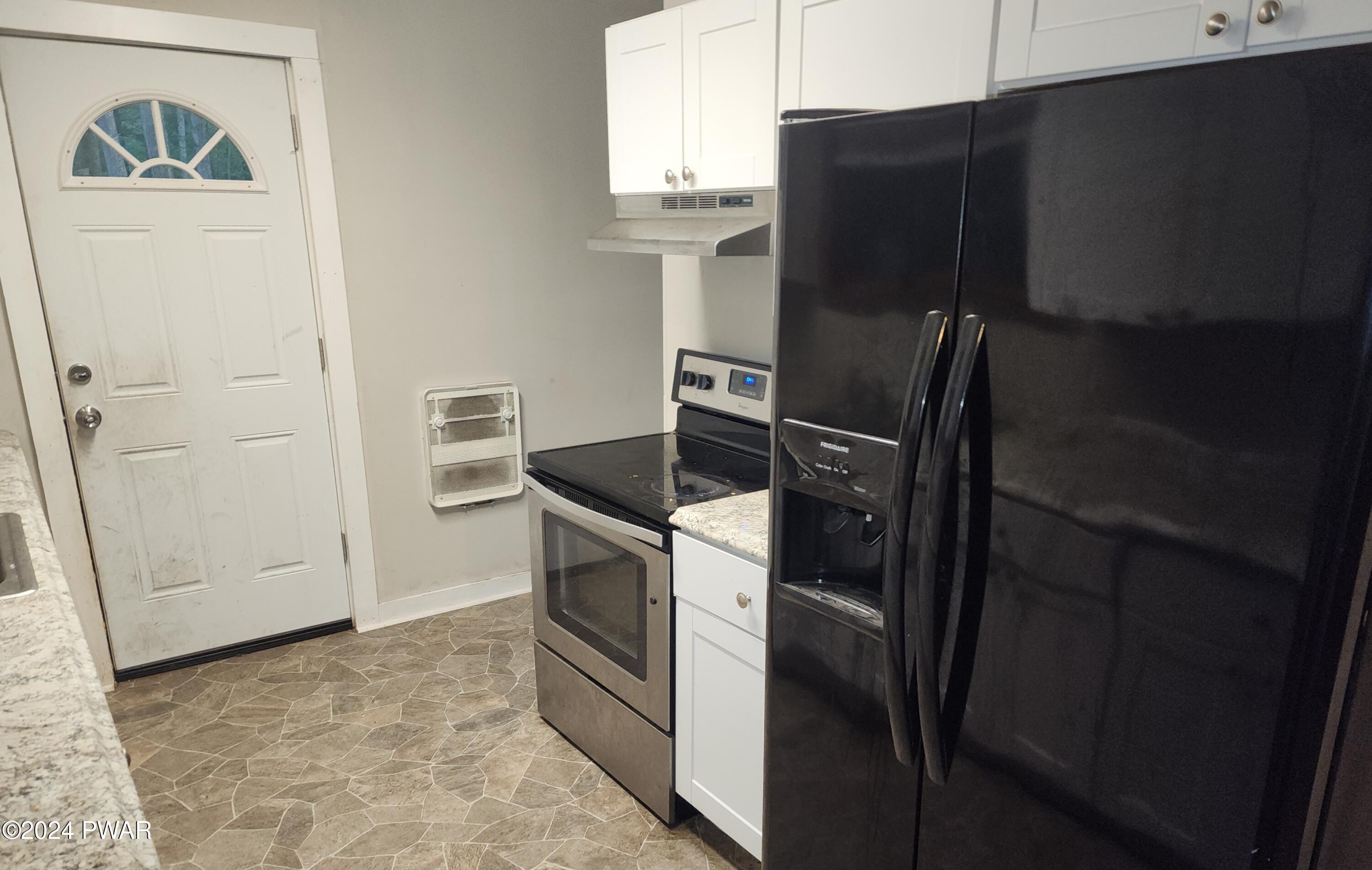 120 Slaymaker Road Milford, PA 18337 - Photo 8 of 28 a kitchen with a refrigerator and a stove