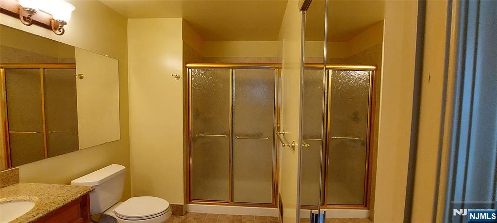1060 Ash Drive Mahwah, NJ 07430 - Photo 14 of 19 a bathroom with a toilet and a shower