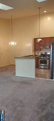 a kitchen with kitchen island a stove and a kitchen island