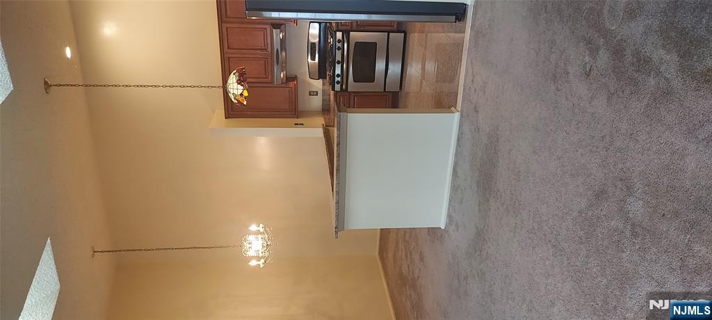 1060 Ash Drive Mahwah, NJ 07430 - Photo 5 of 19 a kitchen with kitchen island a stove and a kitchen island