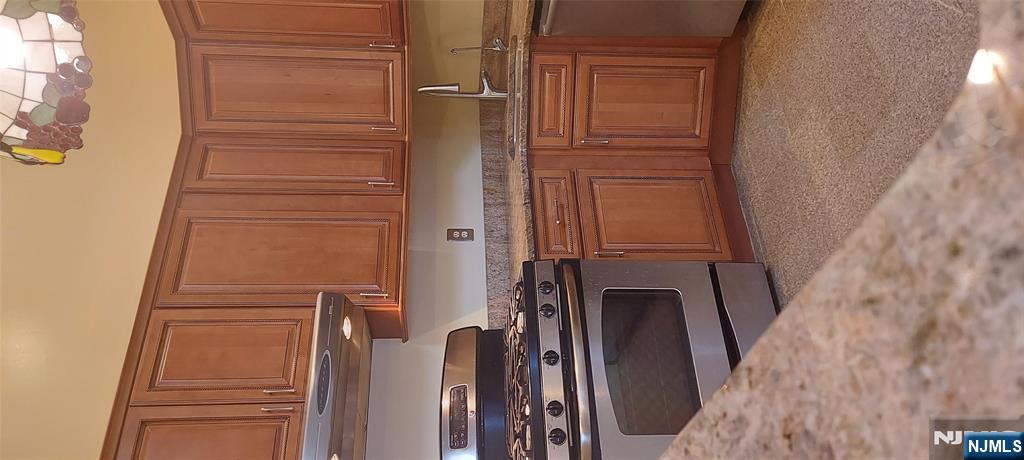 1060 Ash Drive Mahwah, NJ 07430 - Photo 7 of 19 a kitchen with a sink stove and cabinets