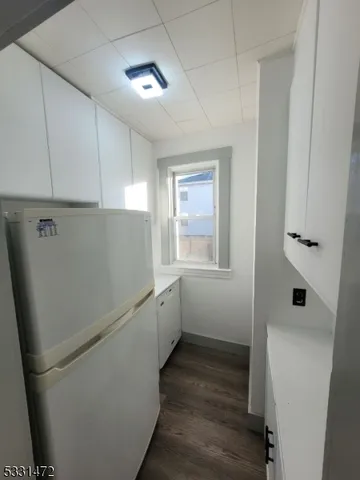 a utility room with closet dryer and washer