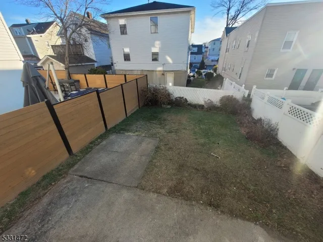 a view of balcony with furniture and a potted plant