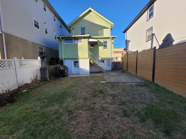 a view of a back yard of the house