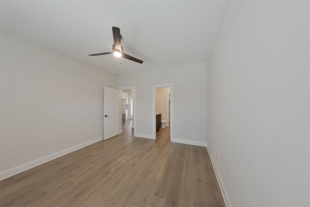 1206 Dye Boulevard Princeton, TX 75407 - Photo 12 of 29 a view of an empty room and wooden floor