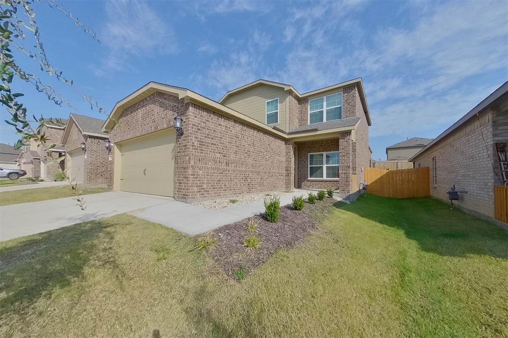 1206 Dye Boulevard Princeton, TX 75407 - Photo 2 of 29 a front view of a house with garden