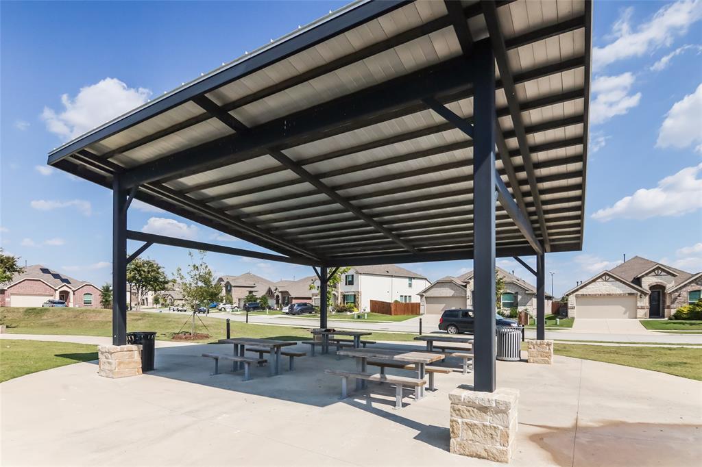 1206 Dye Boulevard Princeton, TX 75407 - Photo 25 of 29 wooden roof deck with table and chairs and potted plants
