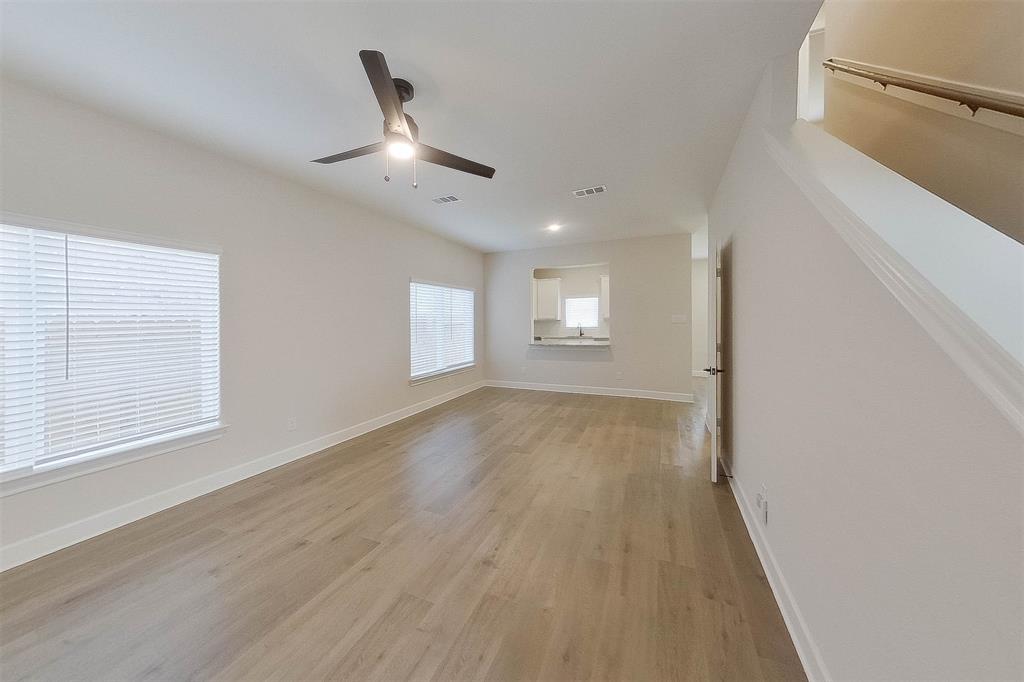 1206 Dye Boulevard Princeton, TX 75407 - Photo 3 of 29 wooden floor in an empty room with a window