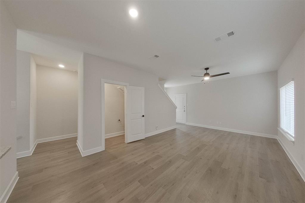 1206 Dye Boulevard Princeton, TX 75407 - Photo 5 of 29 wooden floor in an empty room with a window