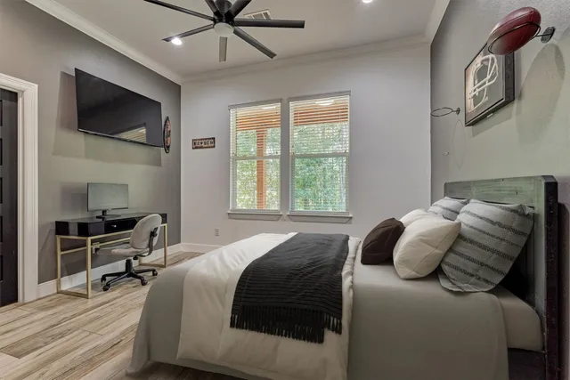 a bedroom with a bed and a flat screen tv