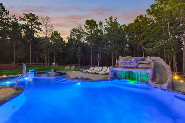 a view of a swimming pool with a patio