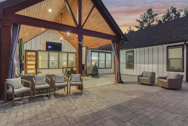 a front view of a house with outdoor seating