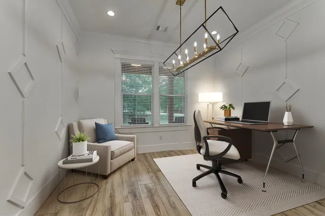 a workspace with furniture wooden floor and a chandelier