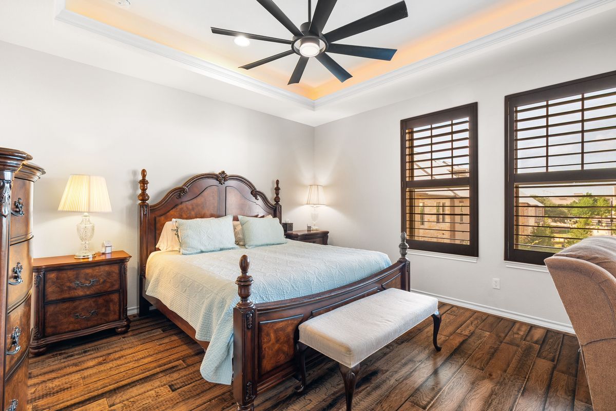 1116 Highknoll Lane Georgetown, TX 78628 - Photo 19 of 36 a bedroom with a bed and wooden floor