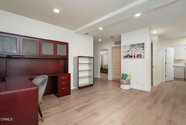 a view of kitchen with stainless steel appliances cabinets