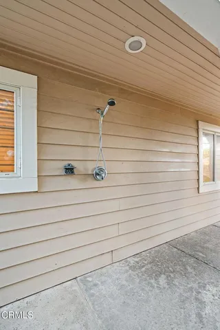 a front view of residential houses with outdoor space and parking