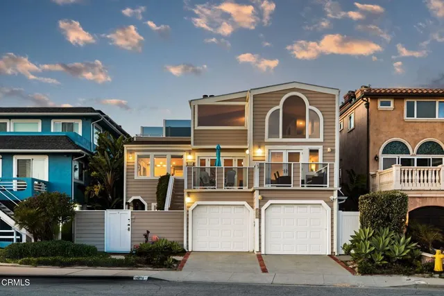 a balcony with table and chairs