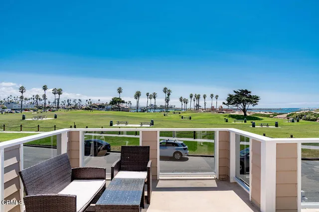 a view of a chairs and table on the terrace