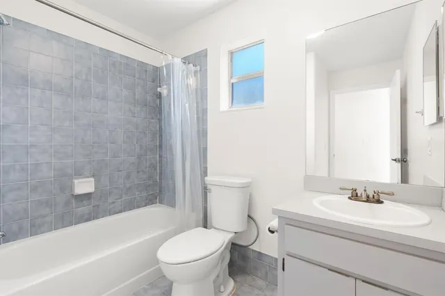 a bathroom with a sink a toilet and a bathtub