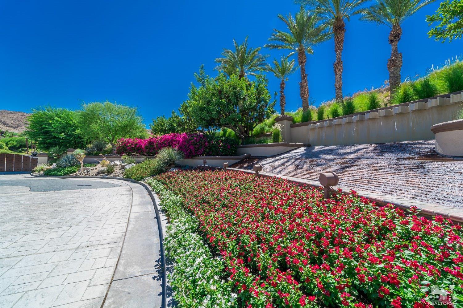 34 Granite Ridge Road Rancho Mirage, CA 92270 - Photo 2 of 7 a view of a pathway with a flower garden