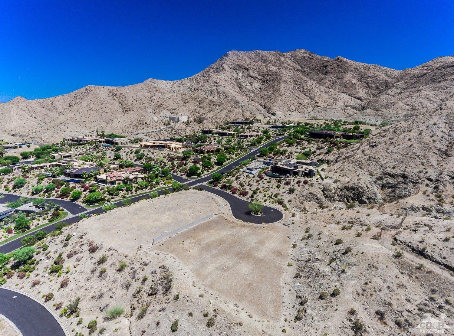 34 Granite Ridge Road Rancho Mirage, CA 92270 - Photo 7 of 7 a view of a dry yard with mountains in the background