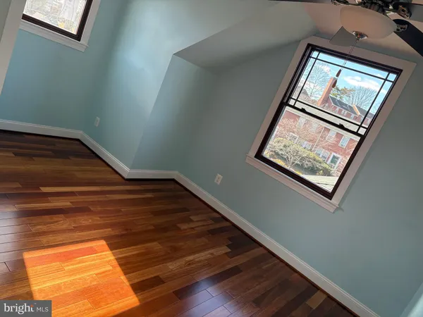 a car parked in front of a brick house
