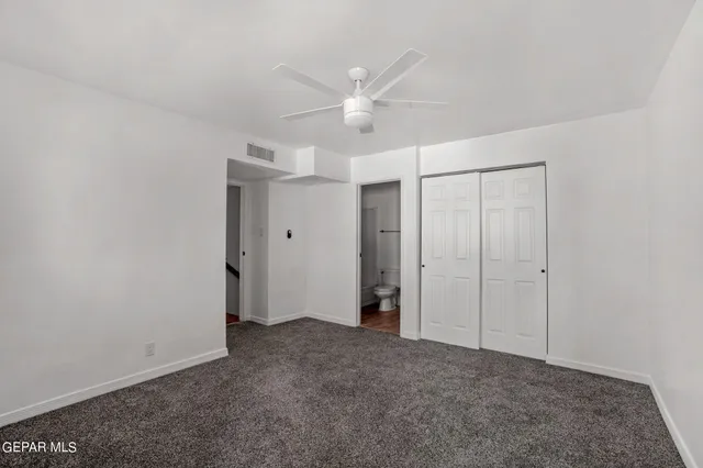 a view of a balcony with wooden floor and fence