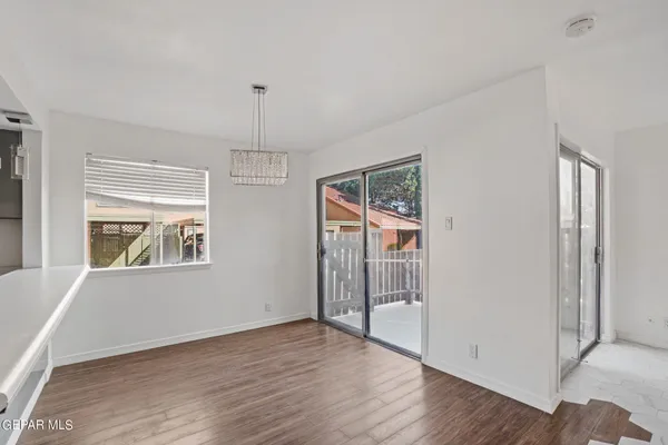 a room with furniture and wooden floor