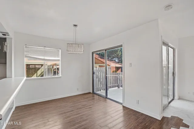 a room with furniture and wooden floor