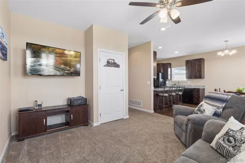 a view of a livingroom with furniture and a flat screen tv