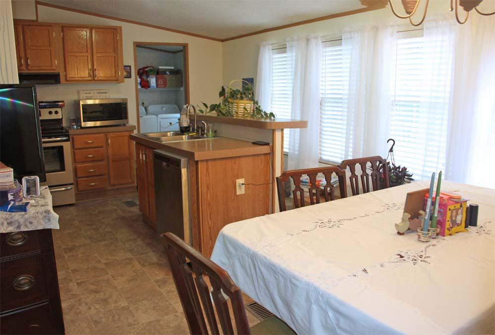 2445 Rutrough Road Southeast Roanoke, VA 24014 - Photo 8 of 23 a kitchen with a sink stove and refrigerator