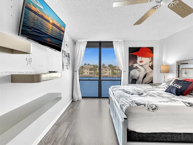 a bathroom with a granite countertop sink mirror and shower