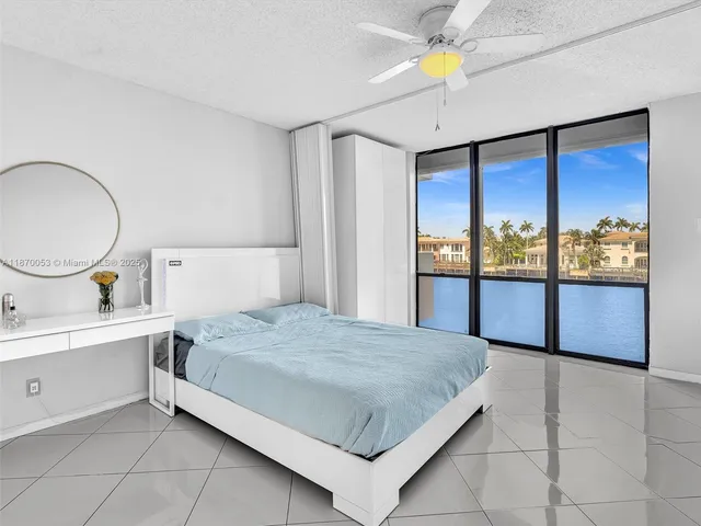 a swimming pool with outdoor seating and plants