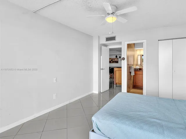 a living room with furniture and a book shelf