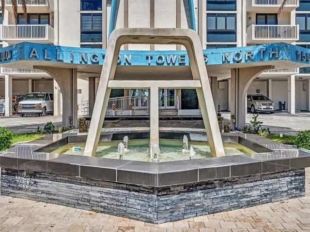 a view of living room with furniture and potted plants
