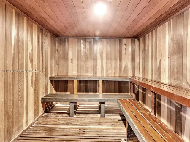 a lobby with furniture and potted plant