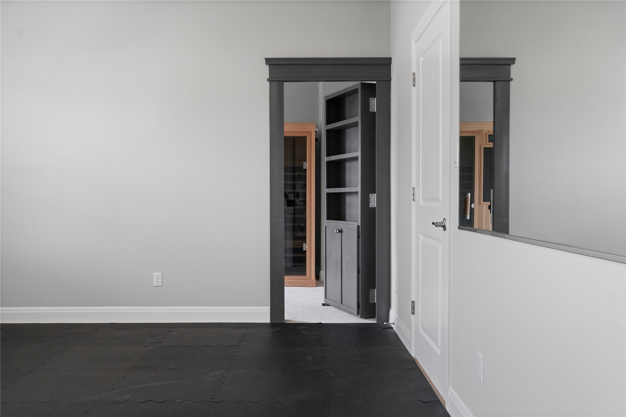 2033 Portobello Road Leander, TX 78641 - Photo 29 of 39 A discrete bookcase door leads to an interior-locking safe room & spa.