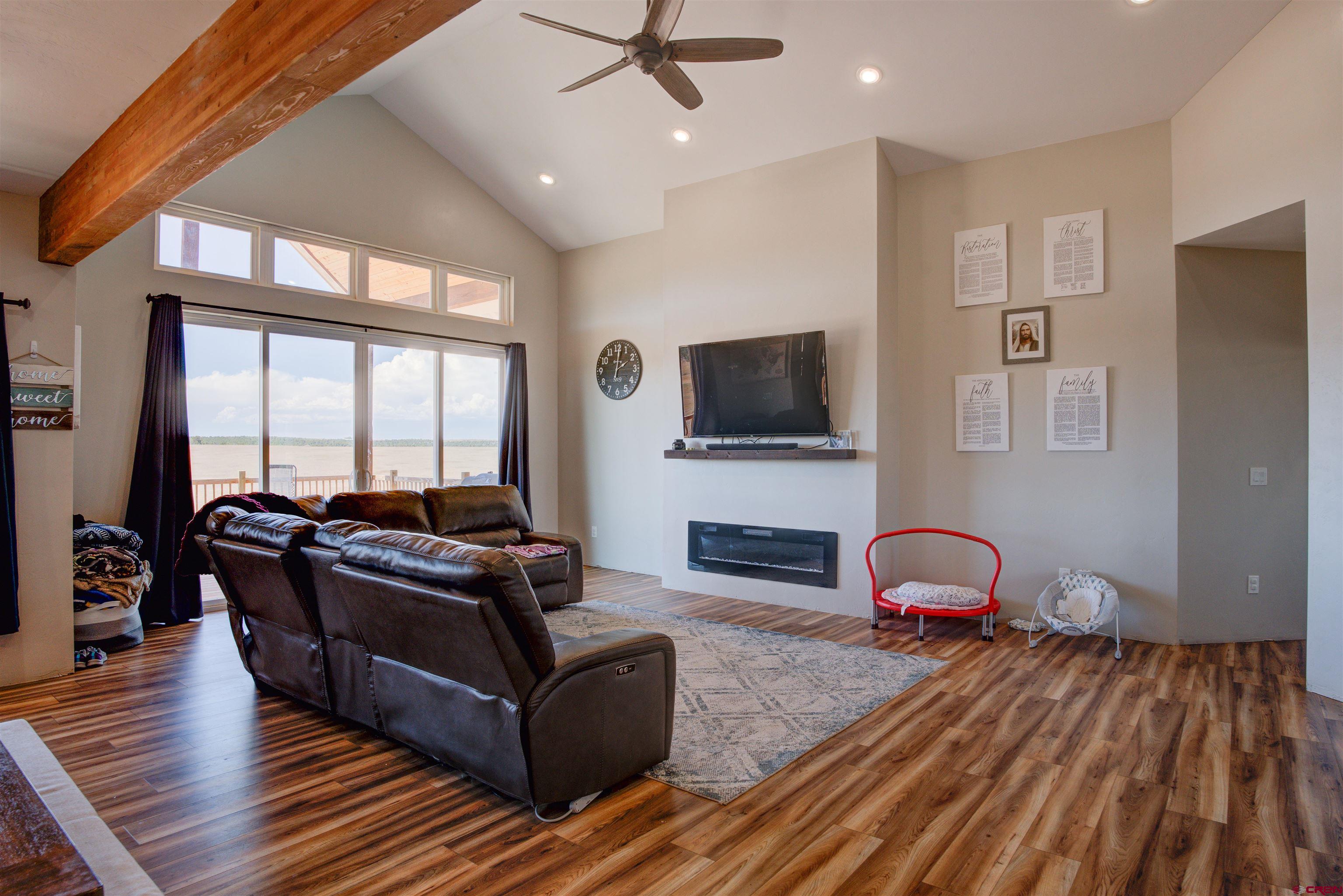 13205 Road 17.9 Loop Cortez, CO 81321 - Photo 11 of 35 a living room with furniture and a flat screen tv