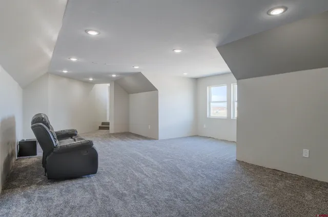 a view of a livingroom with furniture and windows