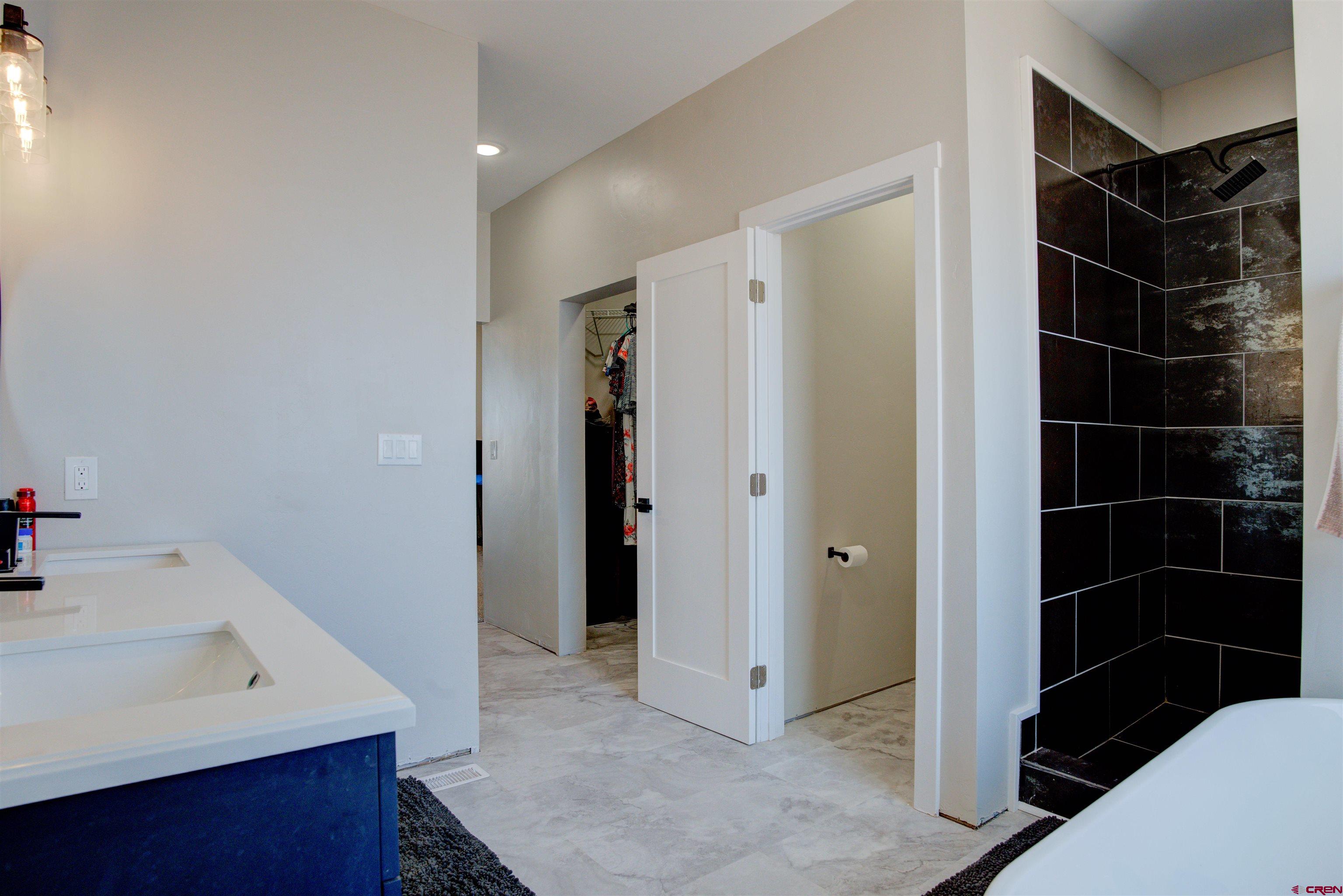 13205 Road 17.9 Loop Cortez, CO 81321 - Photo 21 of 35 a bathroom with a sink toilet and shower