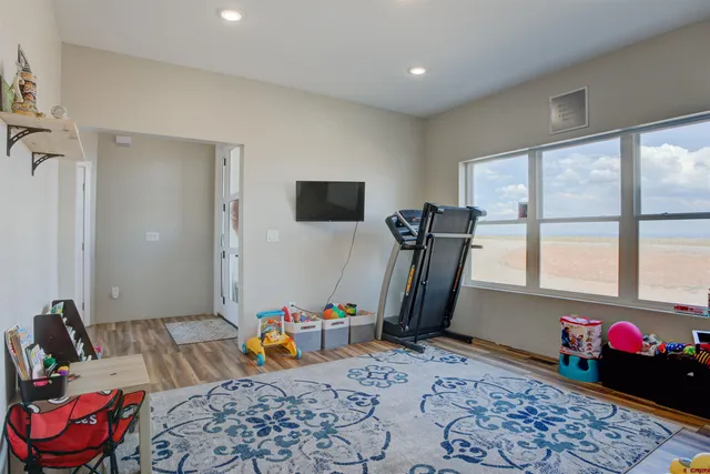 a bedroom with furniture and a window