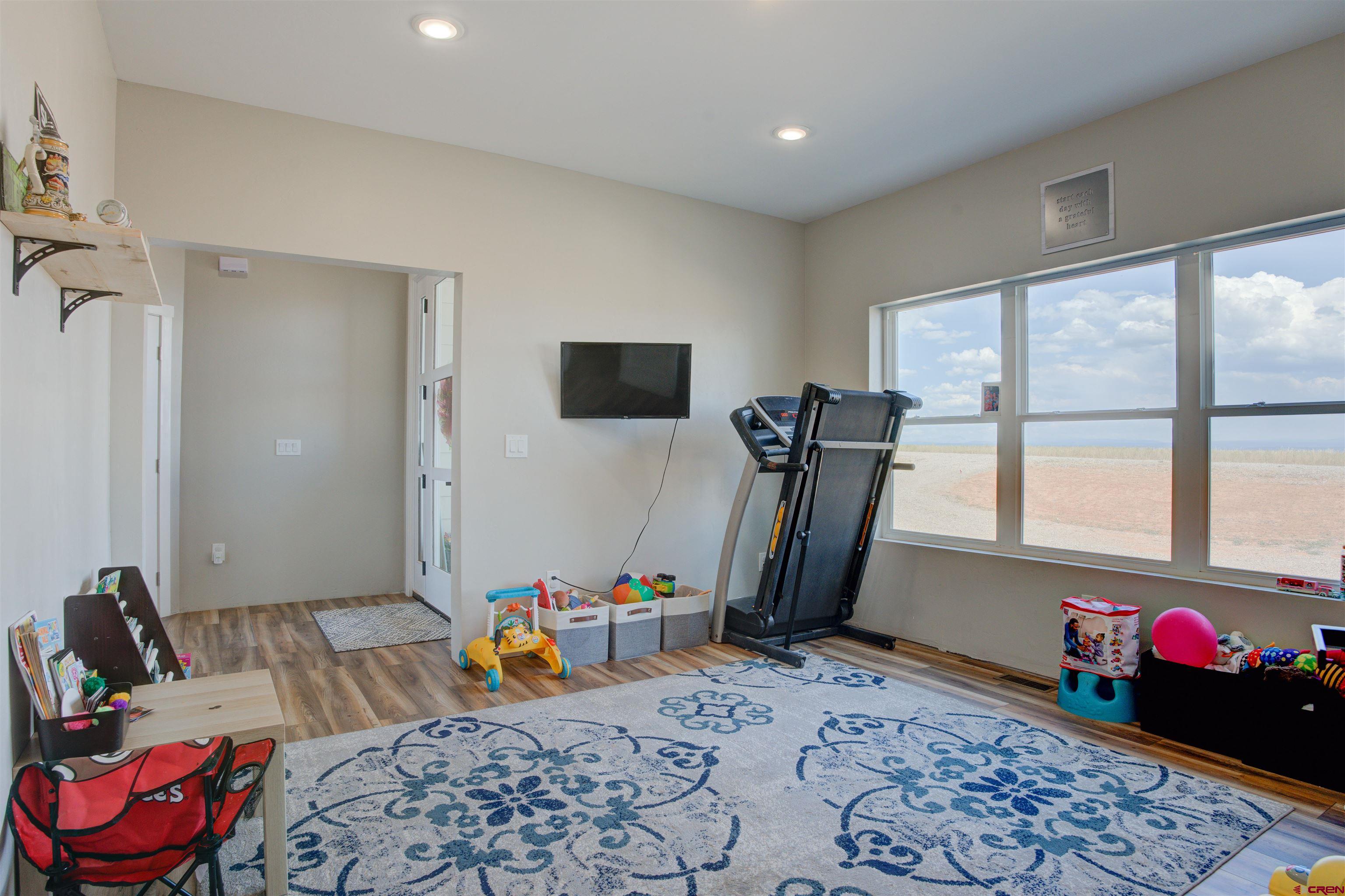 13205 Road 17.9 Loop Cortez, CO 81321 - Photo 24 of 35 a bedroom with furniture and a window