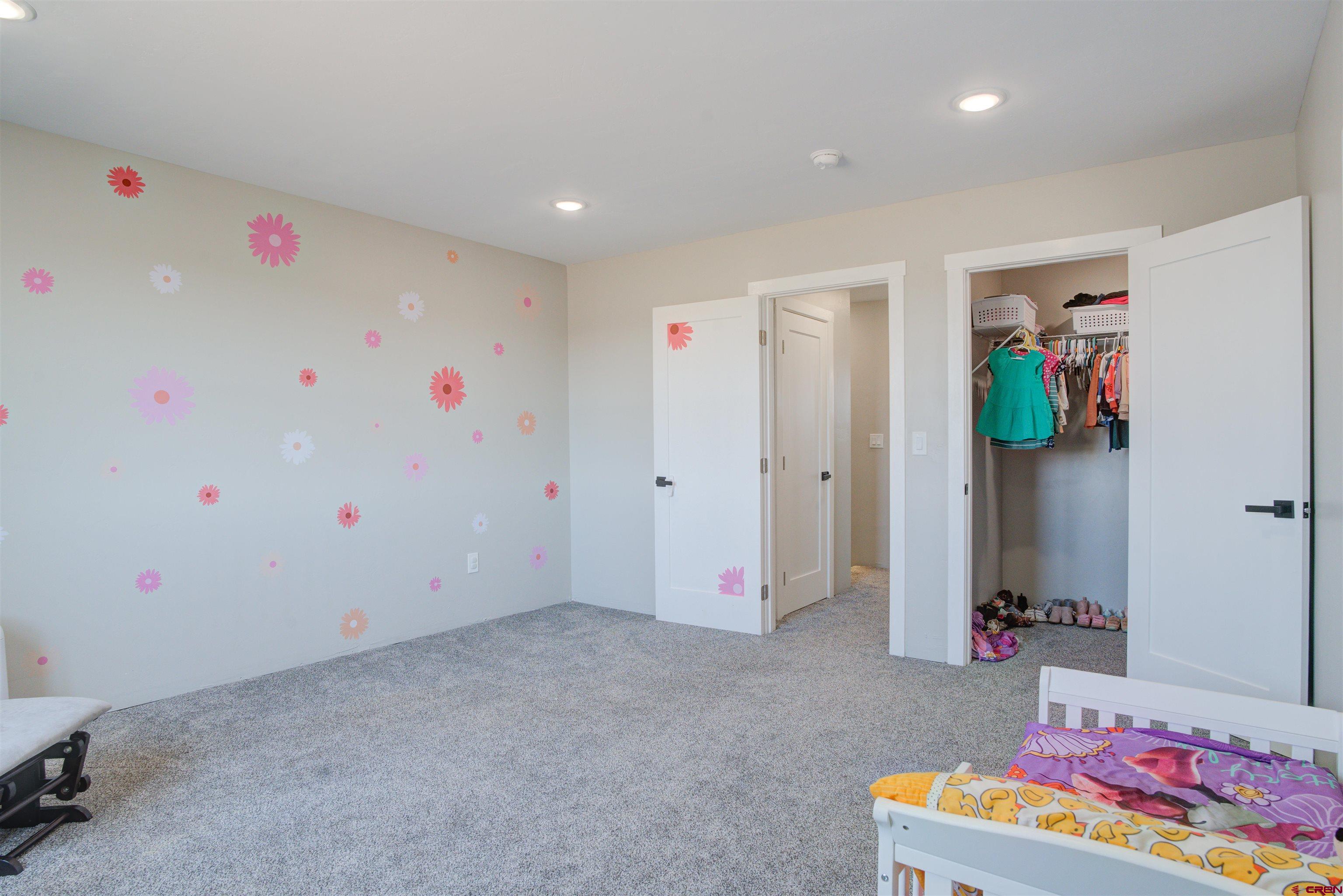 13205 Road 17.9 Loop Cortez, CO 81321 - Photo 26 of 35 a room with toys and wooden floor