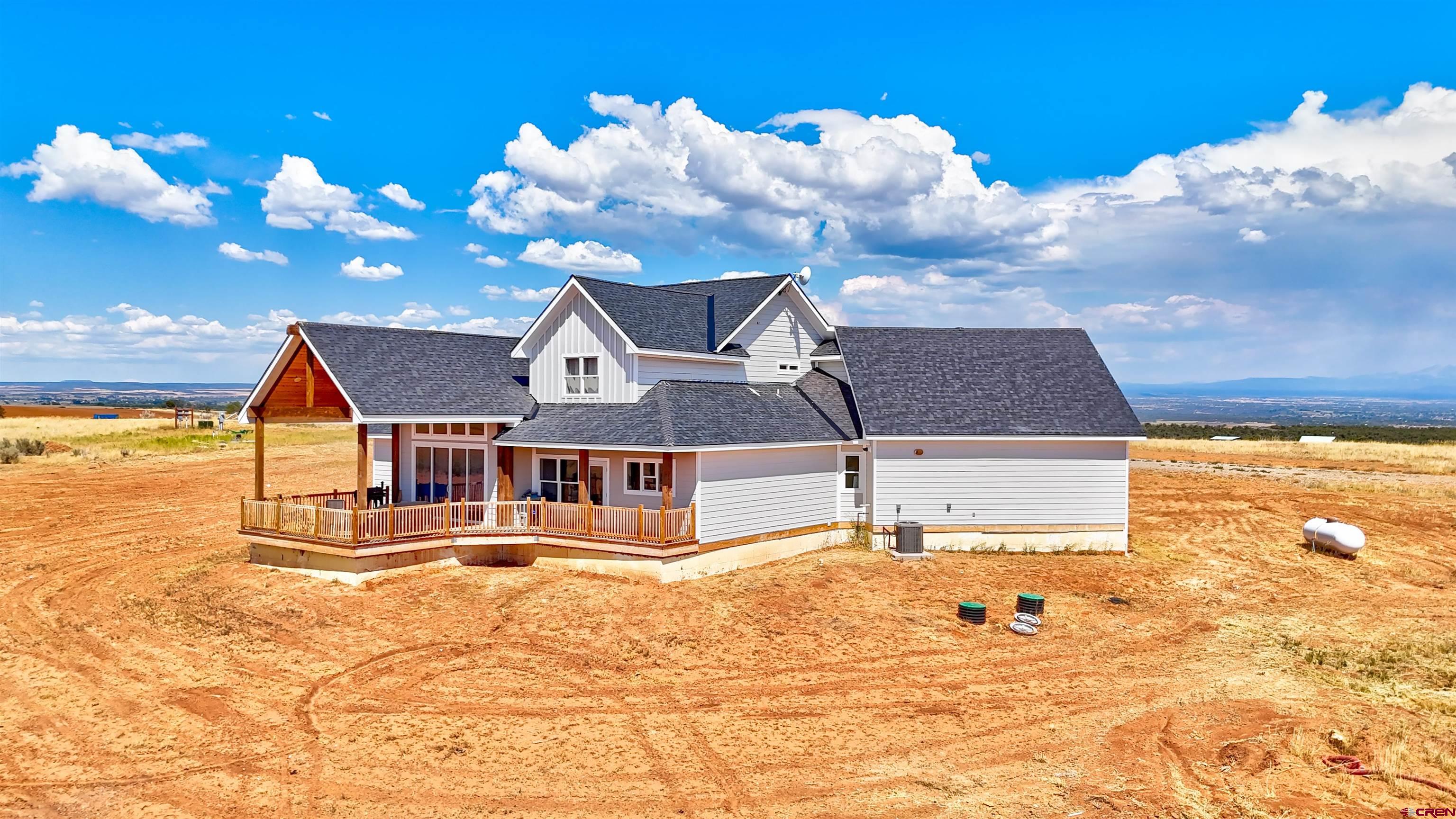 13205 Road 17.9 Loop Cortez, CO 81321 - Photo 3 of 35 a view of a house with a yard