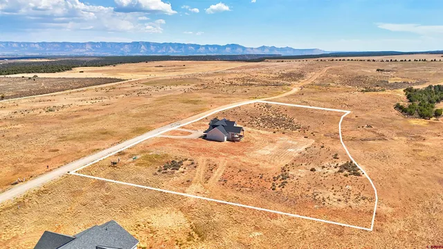 a view of parking garage with cars