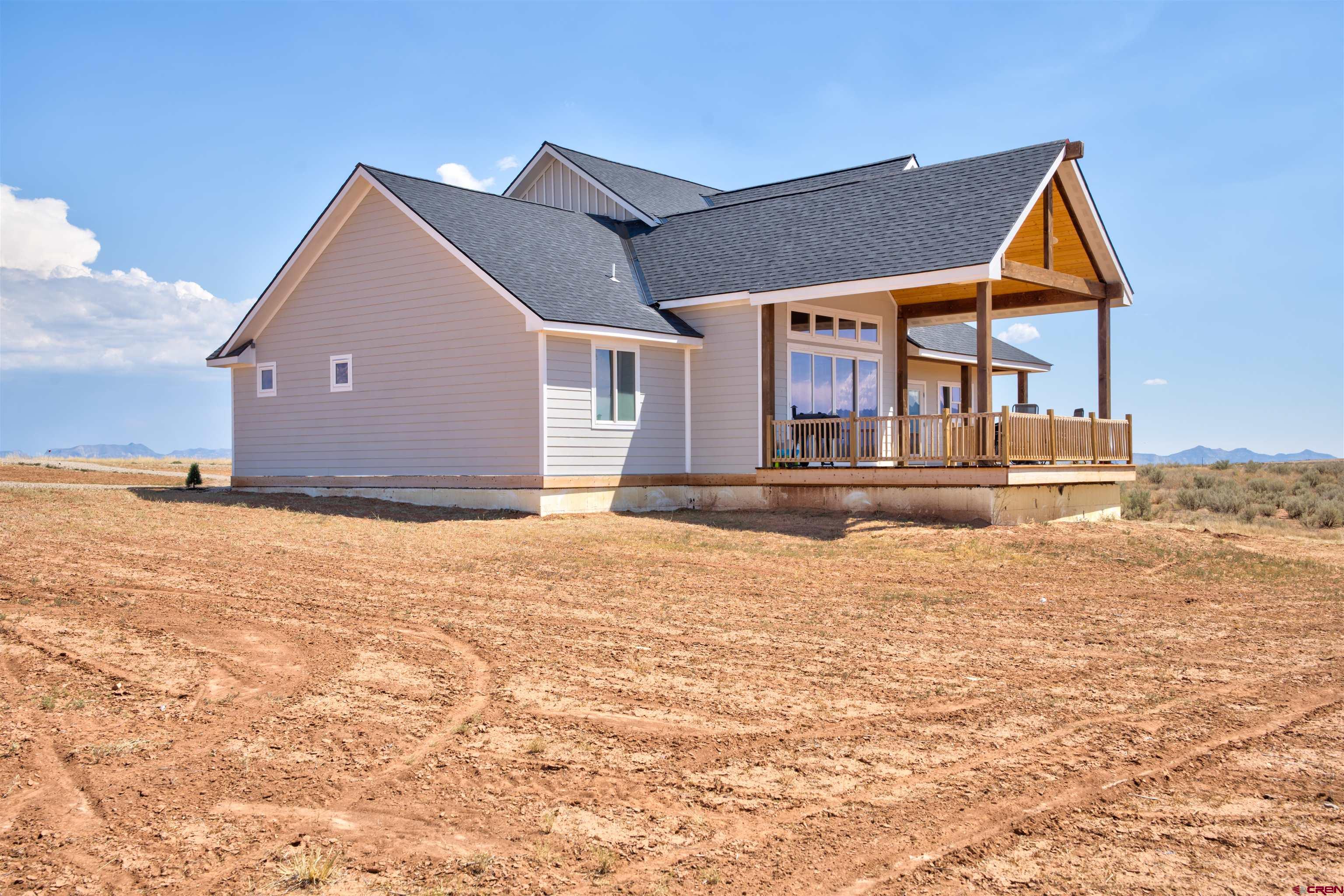 13205 Road 17.9 Loop Cortez, CO 81321 - Photo 6 of 35 a front view of a house with a yard
