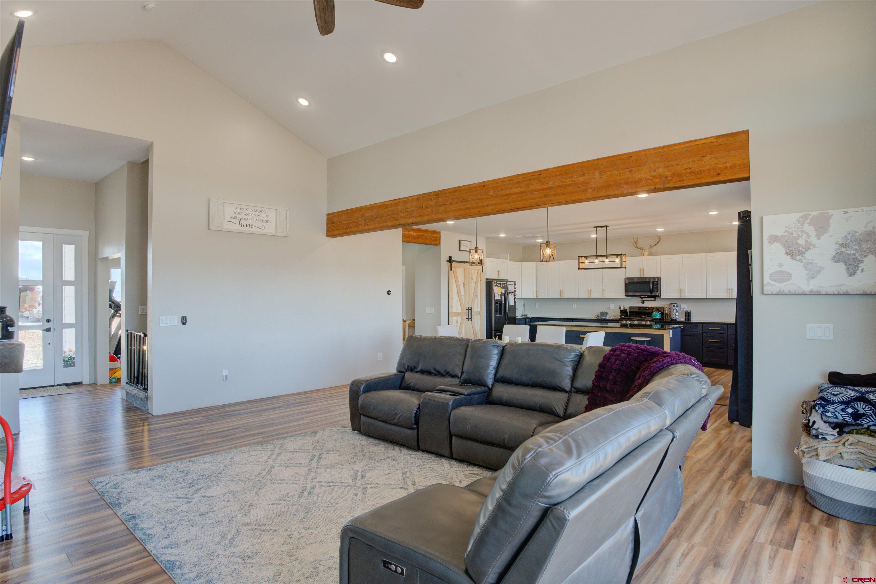 13205 Road 17.9 Loop Cortez, CO 81321 - Photo 9 of 35 a living room with furniture and wooden floor
